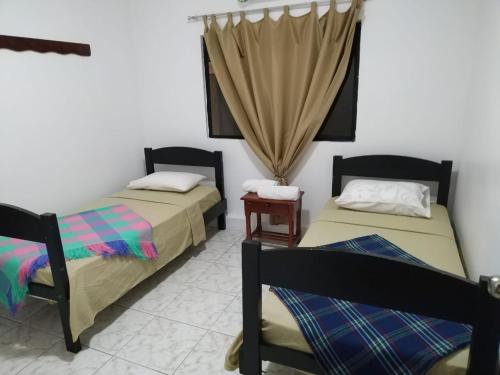 Katil atau katil-katil dalam bilik di Hostal La Casa de Luis
