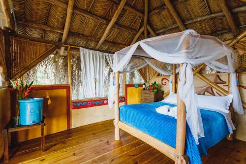 Ένα ή περισσότερα κρεβάτια σε δωμάτιο στο Sol de Minca Eco Lodge