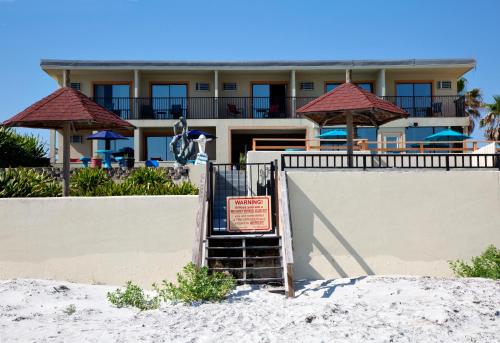 a sign in the sand in front of a resort at Daytona Dream Inn By AmeriVu in Daytona Beach