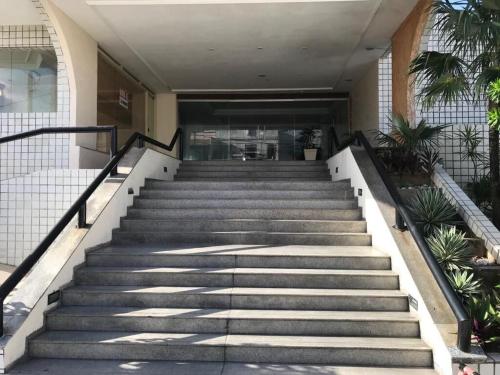 a set of stairs leading to a building at 507 Lindo Flat mobiliado na Praia de Iracema in Fortaleza