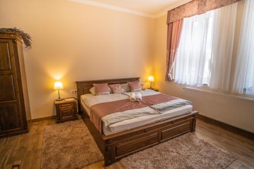 Posteľ alebo postele v izbe v ubytovaní Toscana Apartman