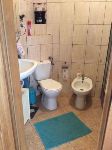 a small bathroom with a toilet and a sink at Apartment next Metro - Adults Only in Warsaw