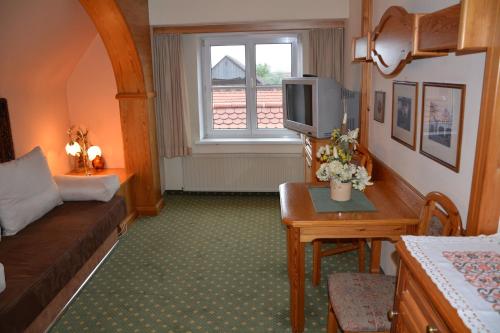 Postel nebo postele na pokoji v ubytování Hotel-Restaurant Fischer
