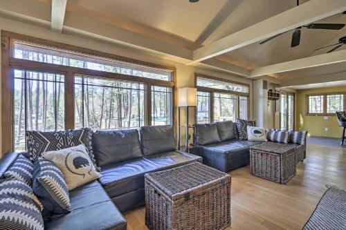 a living room with a couch and chairs and windows at Near Tonto National Forest Dog-Friendly Cabin! in Payson