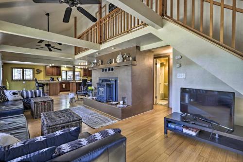 a large living room with a large television and a living room at Near Tonto National Forest Dog-Friendly Cabin! in Payson