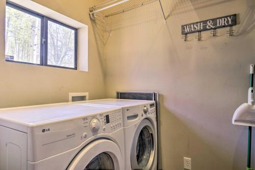 a washing machine in a laundry room with a window at Near Tonto National Forest Dog-Friendly Cabin! in Payson