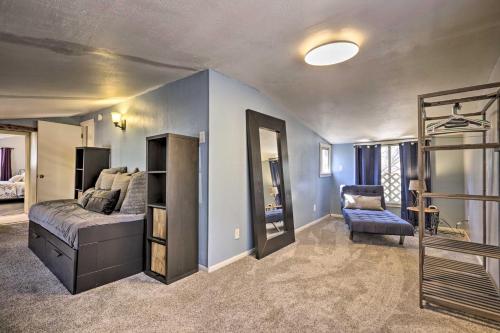 a bedroom with a bed and a chair in a room at Near Tonto National Forest Dog-Friendly Cabin! in Payson