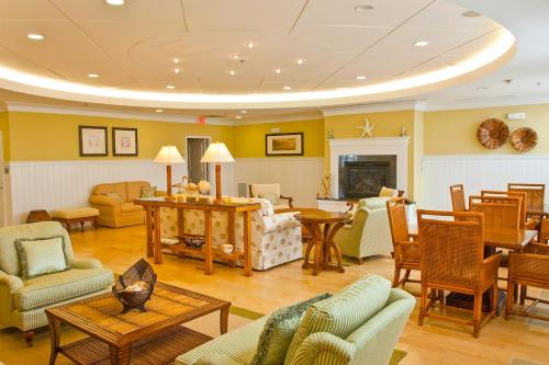 a living room filled with furniture and a fireplace at Sunset Island - 6 Hidden Cove in Ocean City