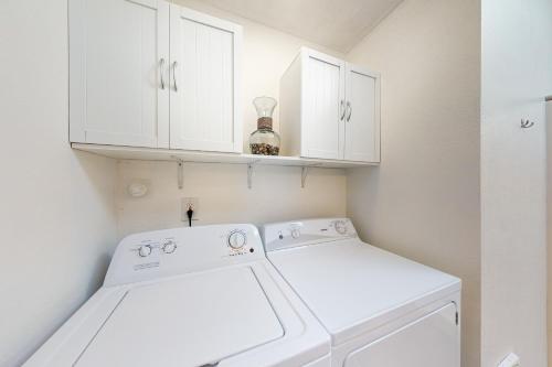 a white washer and dryer in a small kitchen at Sweet Netarts in Tillamook