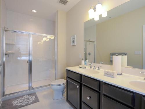 a bathroom with a shower and a sink and a toilet at Seaside Village - Bowline in Ocean City