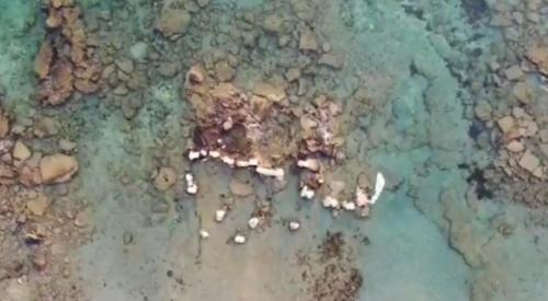 una vista aérea de las rocas en el agua en Tsambikos Apts en Faliraki