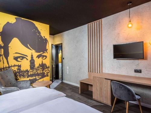 Postel nebo postele na pokoji v ubytování ibis Styles Dresden Neustadt
