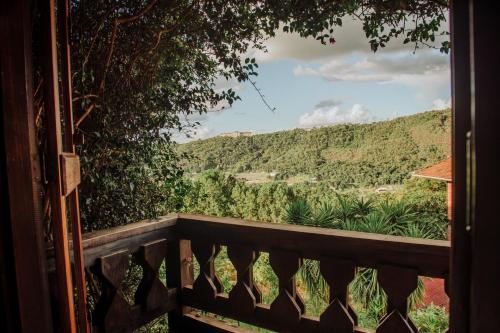 a view from a porch with a view of a mountain at Pousada Pedra Azul in Pedra Azul
