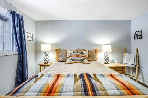 a bedroom with a large bed and two lamps at Rock Ridge 39 in Black Butte Ranch