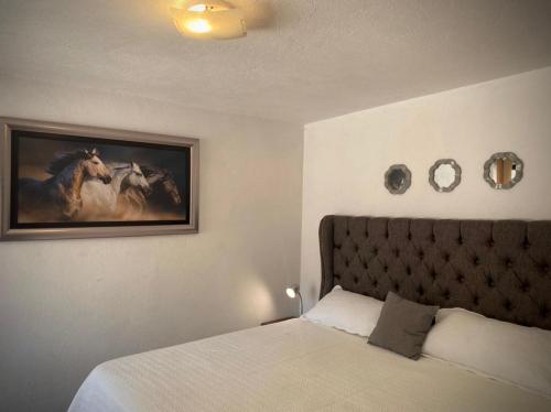 Cama o camas de una habitación en Cabañas Rancho San Jorge