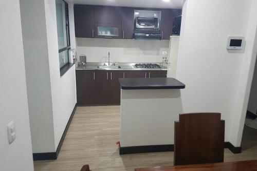 a kitchen with a sink and a counter top at Apartamento La Floresta con todas las comodidades in Bogotá