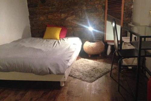 a photographer taking a picture of a bed in a bedroom at Studio Lyon 1er in Lyon