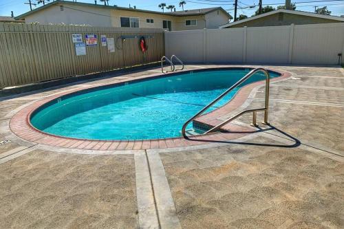 a small swimming pool with a metal rail around it at City Center Villa - Pool, Patio & Close To Beach! in Huntington Beach