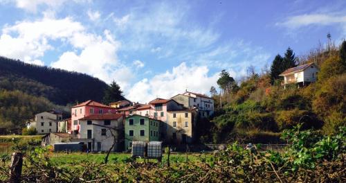a group of houses on the side of a hill at Sea Levanto and Cinque Terre Calm, cool, freedom,for children and pet Parking in Carrodano Inferiore