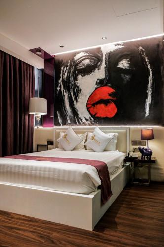 Postel nebo postele na pokoji v ubytování Signature Boutique Hotel