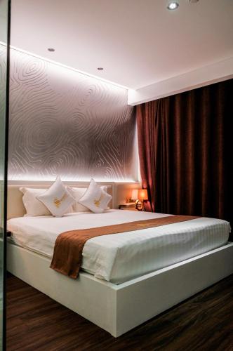 Postel nebo postele na pokoji v ubytování Signature Boutique Hotel