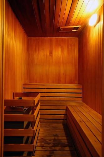 an empty courtroom with wooden benches and a light at Avillion Port Dickson in Port Dickson
