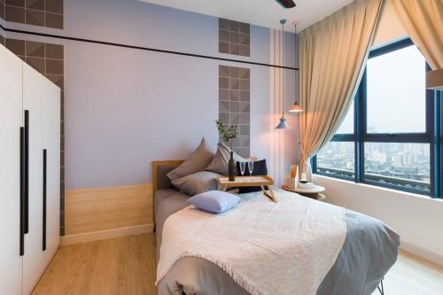 a bedroom with a large bed and a large window at New! Contemporary 1BR Apartment near KLCC in Kuala Lumpur