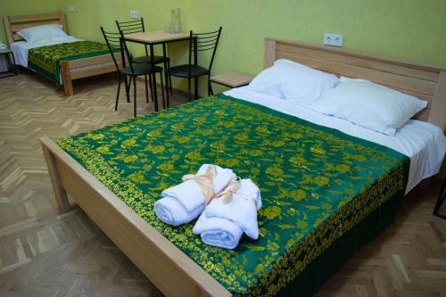 Ένα ή περισσότερα κρεβάτια σε δωμάτιο στο Sunflower Hotel