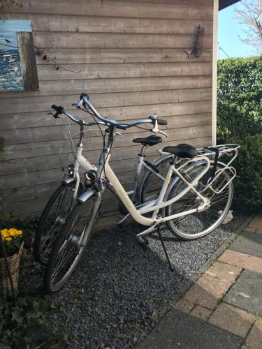 a bicycle is parked next to a house at Apartment Zonnehoek in Aagtekerke
