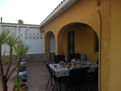 A restaurant or other place to eat at Villa with garden and pool in Denia