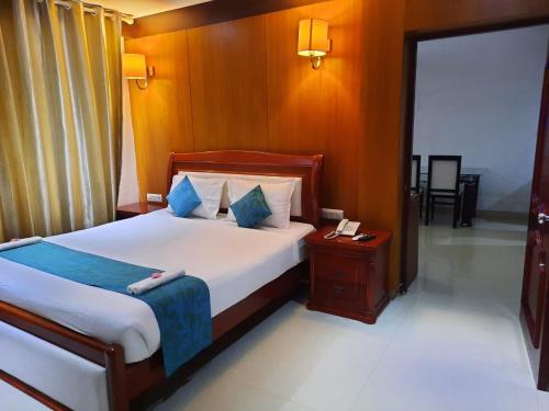 En eller flere senger på et rom på Hotel SS Palace