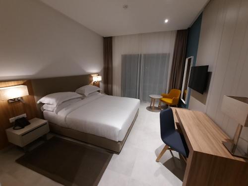 Ein Bett oder Betten in einem Zimmer der Unterkunft Zephyr Mazagan