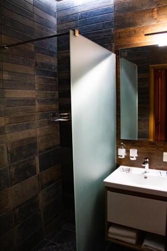 a bathroom with a sink and a mirror at Pidkova in Rivne