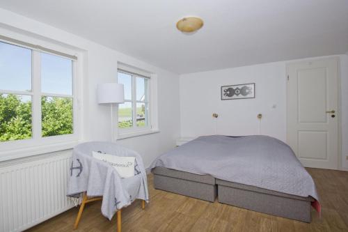 Postel nebo postele na pokoji v ubytování strandnahe Idylle am Meer, private Badestelle mit Strandkorb - Gutshof Ostseeblick FeWo Nr 02