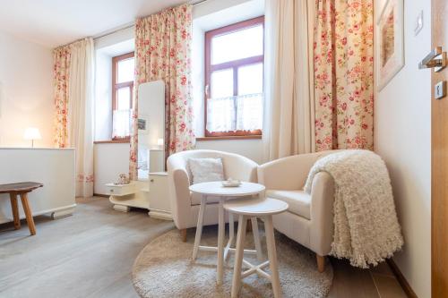 a living room with a couch and a table at U Stařenky in Dolní Bojanovice