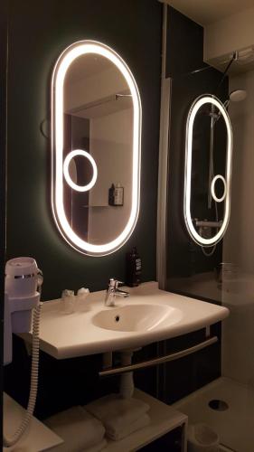 Ванная комната в Ibis Annecy - Cran-Gevrier