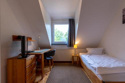 Una cama o camas en una habitación de Appartementanlage am Arnumer See