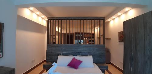 Ένα ή περισσότερα κρεβάτια σε δωμάτιο στο Alia Beach Residence