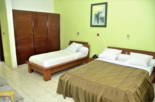 Кровать или кровати в номере Hotel - Y