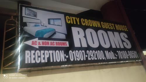 a sign that says city grown guest rooms on a wall at CITY CROWN GUEST HOUSE in Sundarnagar