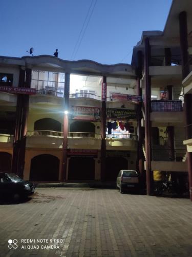 an empty parking lot in front of a building at CITY CROWN GUEST HOUSE in Sundarnagar