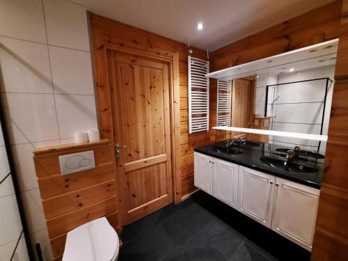 a bathroom with a sink and a toilet at Holiday Park Dennenbos in Oostkapelle