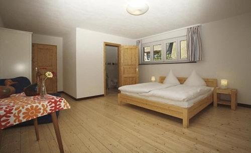 Postel nebo postele na pokoji v ubytování Gästehaus Wald und See