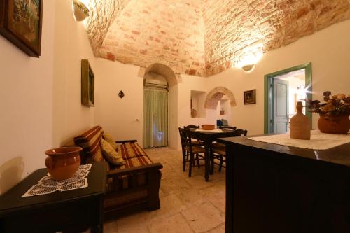 a living room with a couch and a table at Trulli La Zisa in Fasano