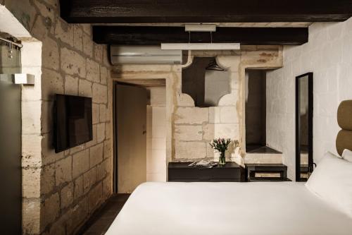 Ένα ή περισσότερα κρεβάτια σε δωμάτιο στο 19 ROOMS