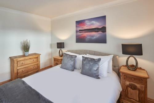 a bedroom with a large white bed with two night stands at Host & Stay - Amber Shores in Saltburn-by-the-Sea