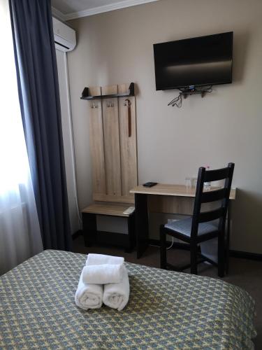 Orange Hotelにあるベッド
