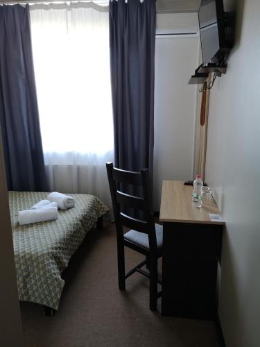 Orange Hotelにあるベッド