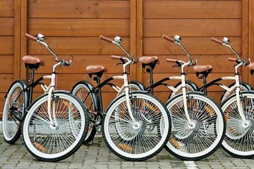 a row of bikes parked next to a wall at Gästehaus Wald und See in Titisee-Neustadt