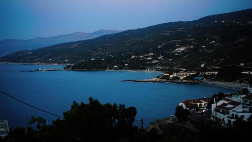 a view of a large body of water with houses at Pension Galini in Armenistis
